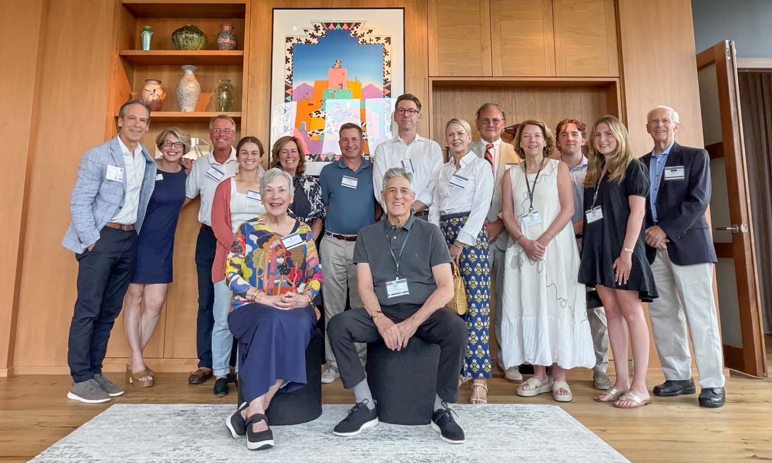 Guests gather for a photo at the Twin Cities summer gathering, hosted by Steve Cohen '67 (center) at his home. 