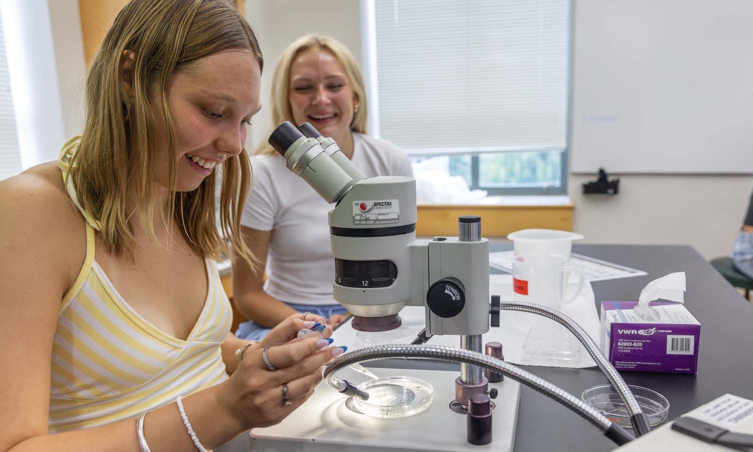 Taylor Bright ’30 and Taylor Williams ’30 observe developing frog (Xenopus leaves) embryos during “The Science of Us” with Professor of Biology Kristy Kenyon.