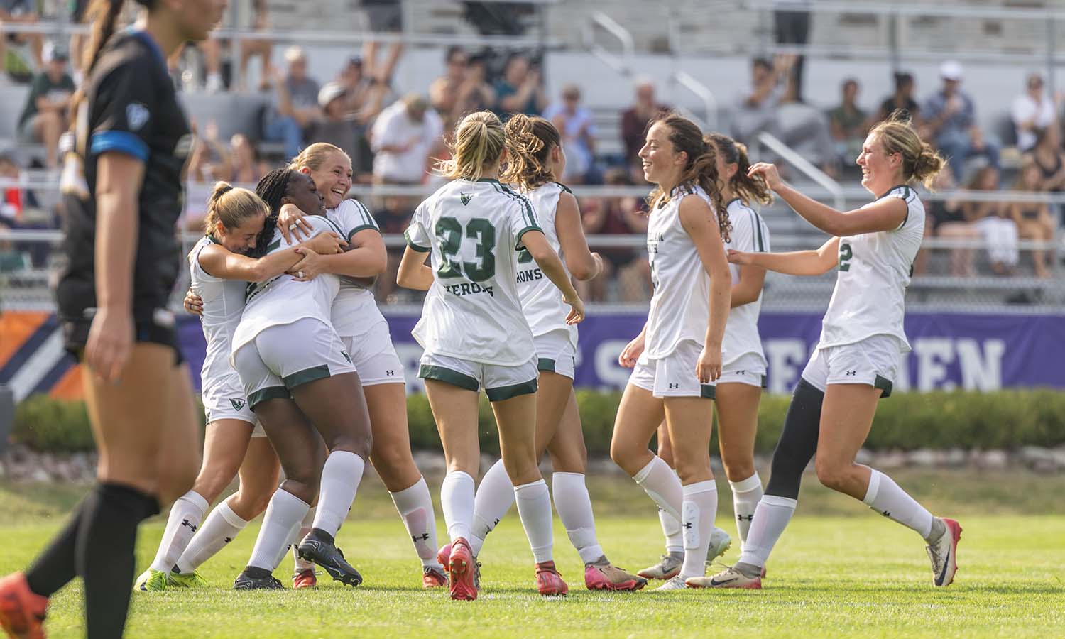 The William Smith soccer team celebrates Ameya Moncrieffe's second goal of the game during the Herons' 4-0 win over Emmanuel. 