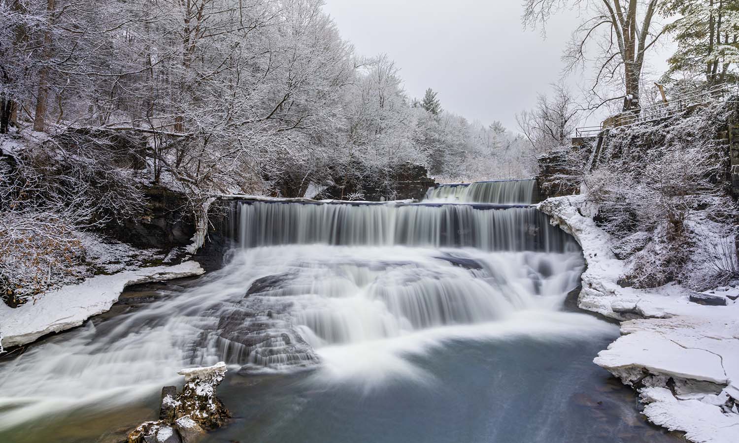 Along the Keuka Outlet Trail, the Seneca Mills Falls rushes toward Seneca Lake. 