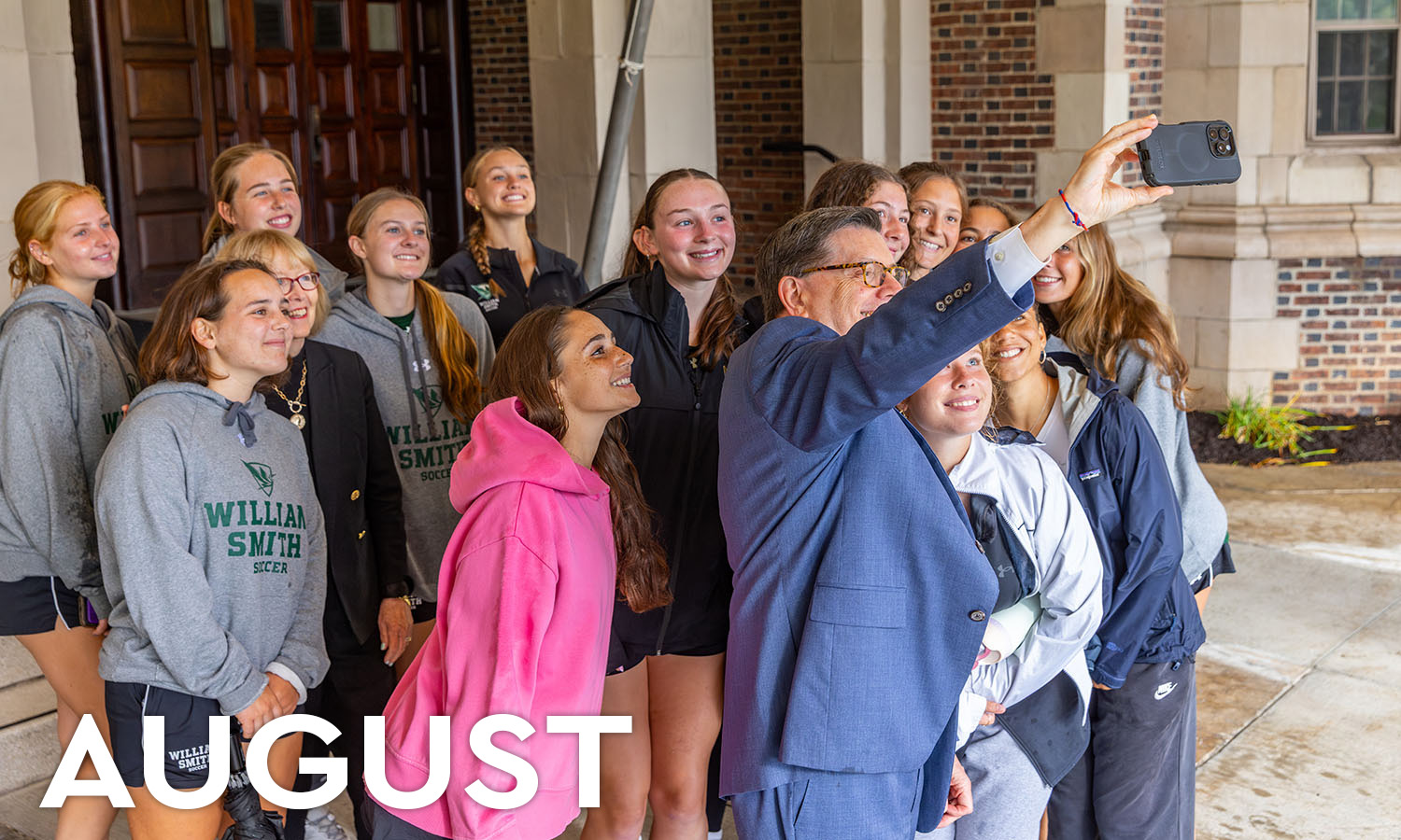 President Mark D. Gearan and Mary Herlihy Gearan take a selfie with first-years on the William Smith soccer team during Orientation in August. 