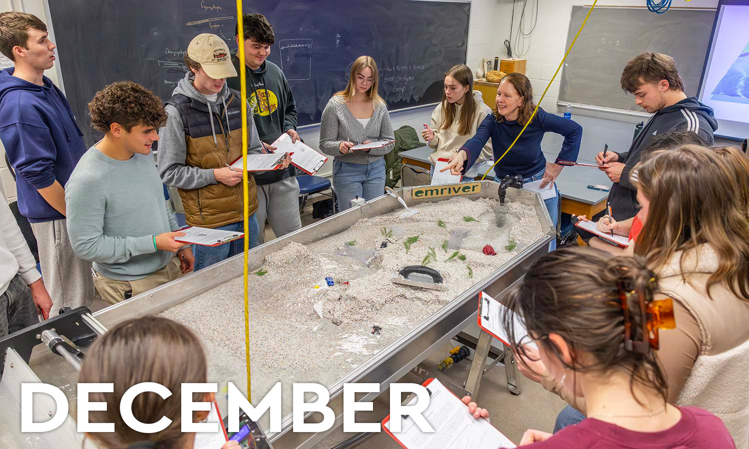 During the last week of classes, Associate Professor of Geoscience Tara Curtin leads students through a lab using a stream table to simulate the effects of long-term erosion during “Introduction to Hydrogeology.” 