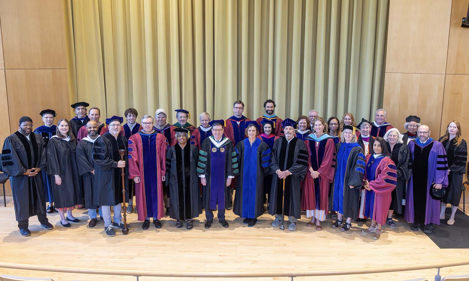 HWS Trustees, President Mark D. Gearan, honorary degree recipients, 25th reunion marshals, faculty speakers and clergy gather in Froelich Hall of the Gearan Center. 