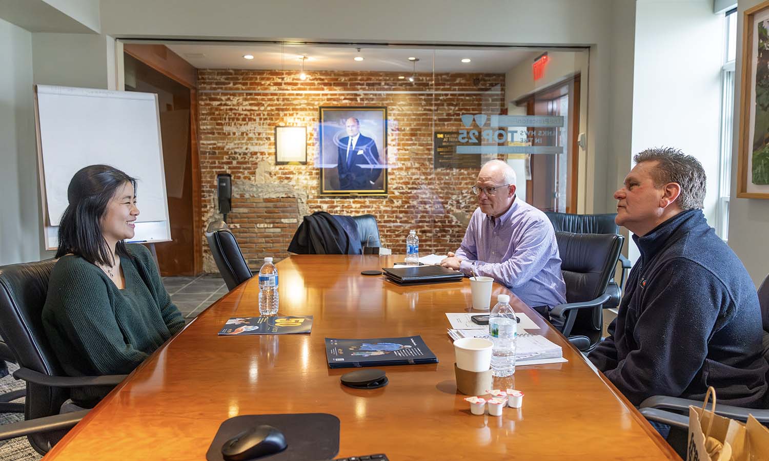 Lily Winch ’28 interviews for a summer internship with Gift of Life International Member Mike Fisher P’18 and CEO of Gift of Life International Robert Raylman ’84 in the Salisbury Center for Career Services. 