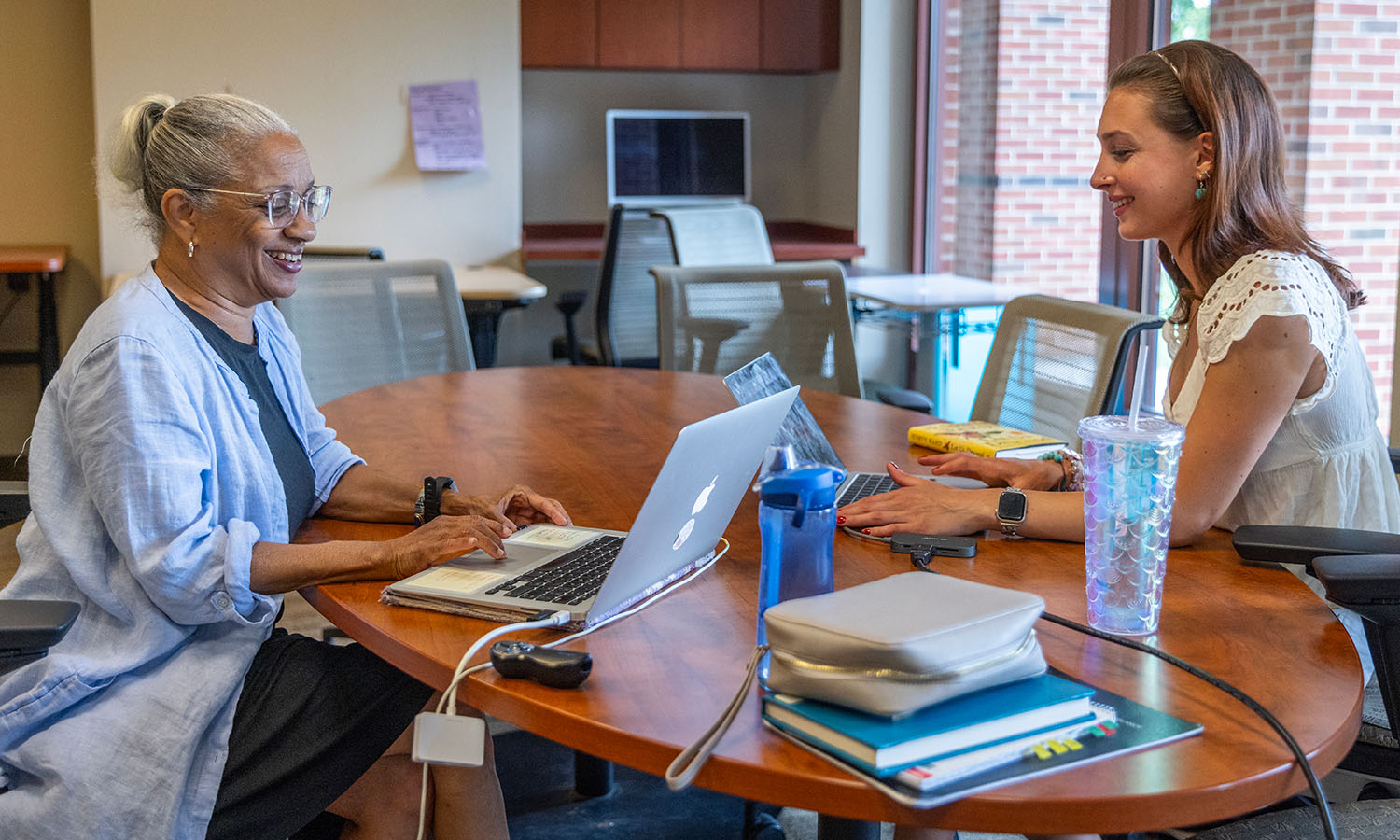 Associate Professor of History Janette Gayle and Alexandra Dickinson ‘27 examine the Mapping Harlem Digital Project, studying settlement patterns and neighborhood formation in Harlem, with a focus on Black self-employed dressmakers from 1900-1920. 