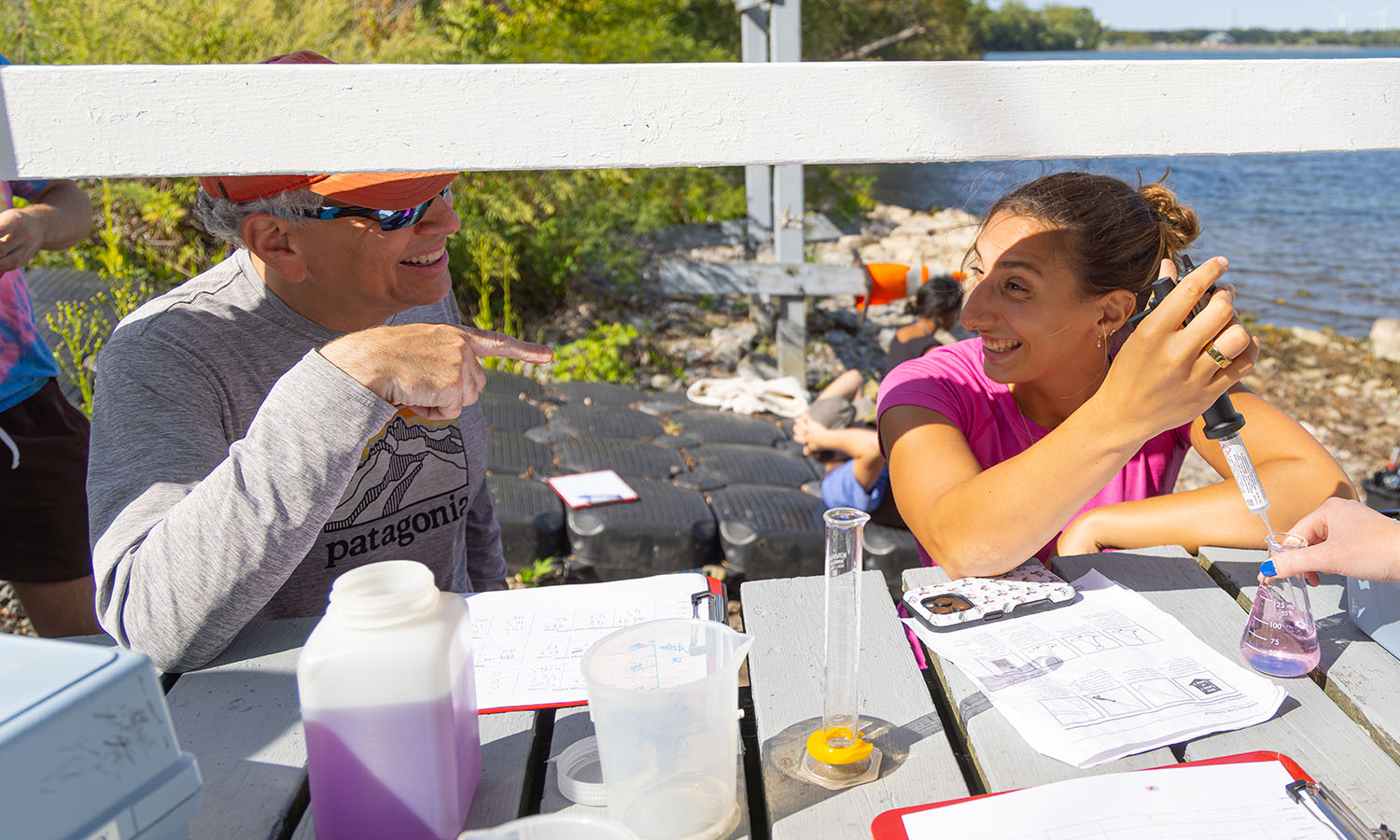 At the Bozzuto Boathouse, Associate Professor of Geoscience David Finkelstein and Kate Abdalla '26 titrate lakeshore water to decipher groundwater flow into Seneca Lake. 