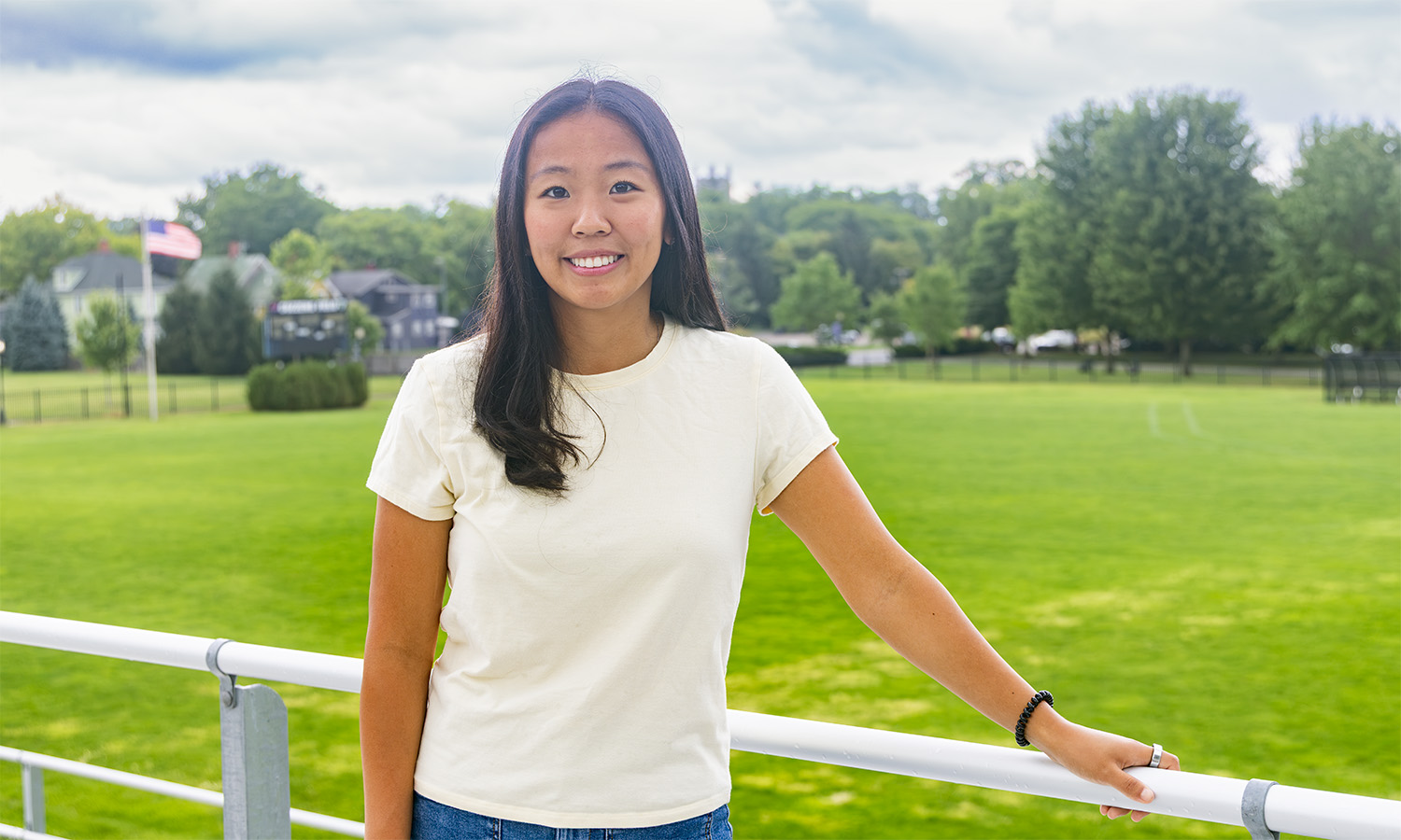 A member of the William Smith soccer team, Rachel Lee ’27 poses in front of Cozzens Fields. 