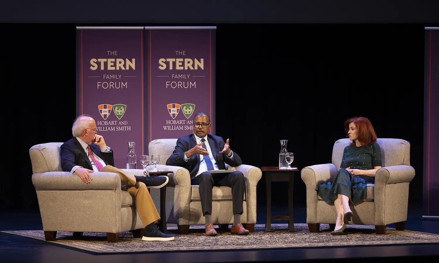 60 Minutes correspondent and HWS Trustee Bill Whitaker ’73, L.H.D. ’97 (center) moderates a conversation between The New York Times’ Maureen Dowd and Republican strategist and Wall Street Journal columnist Karl Rove at the Smith Opera House during the 2026 Stern Family Forum.