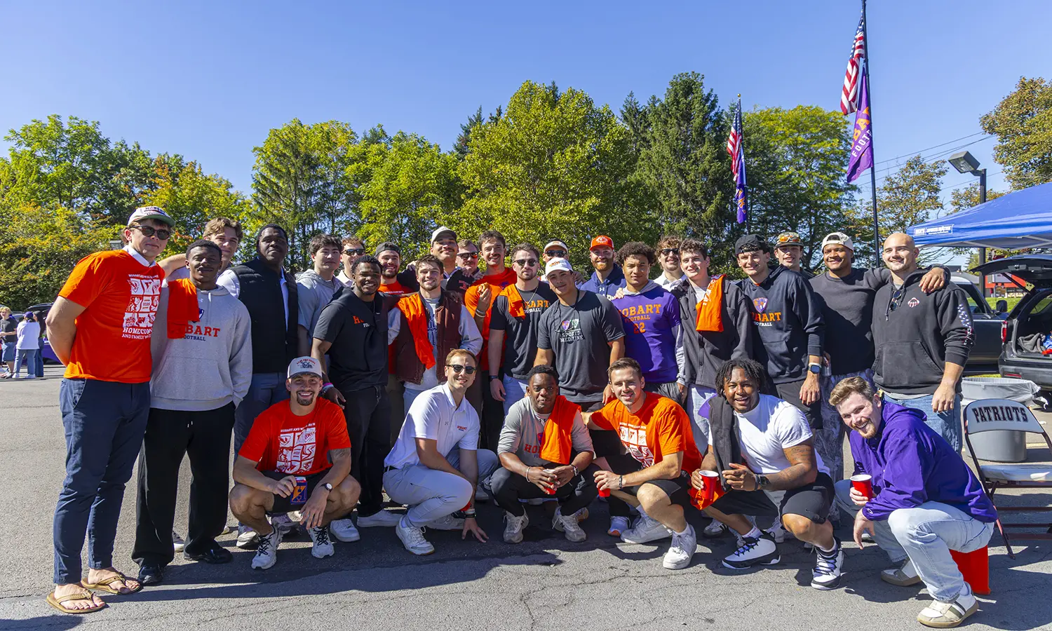 Hobart Football alumni gather for a group picture while tailgating at David J. Urick Stadium. 