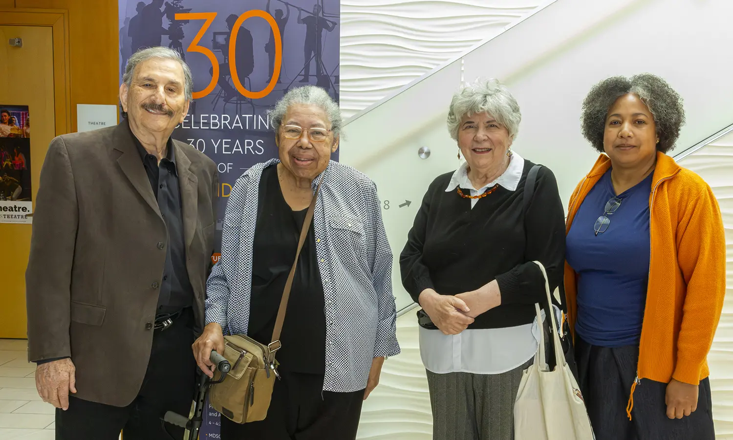 Associate Professor Emeritus of Africana Studies Marilyn Jimenez, Emeritus Professor Emeritus of Media and Society Linda Robertson, and Associate Professor of English and Creative Writing Nicola A. Minott-Ahl gather for a photo during the Media and Society Program's 30th Anniversary celebration.  
