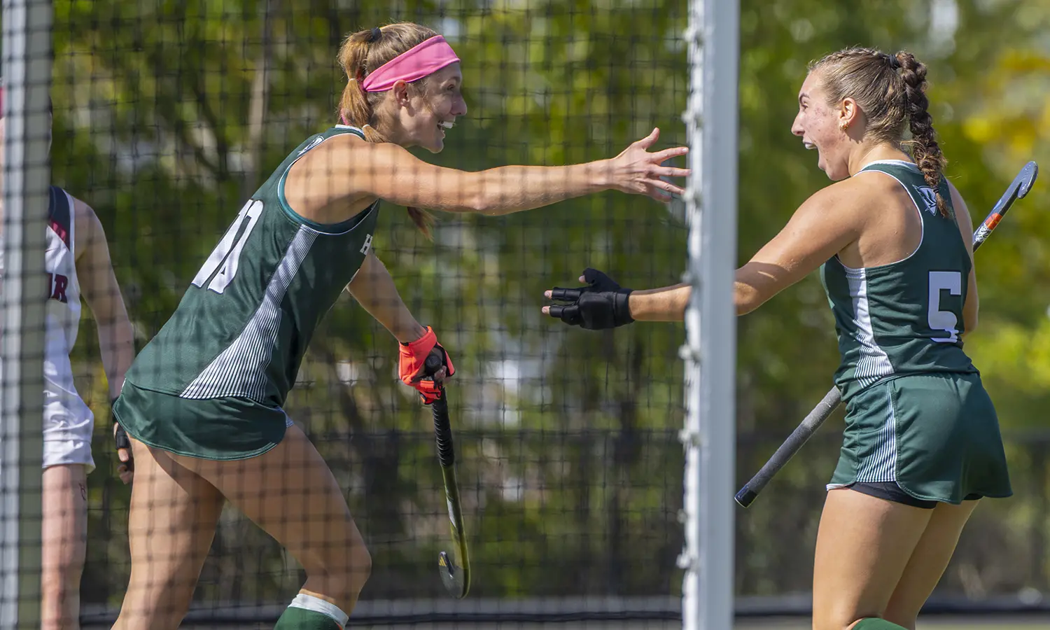 Abigail Mantione '30 celebrates with Eliza Freeland '28 after scoring a goal against Vassar. 