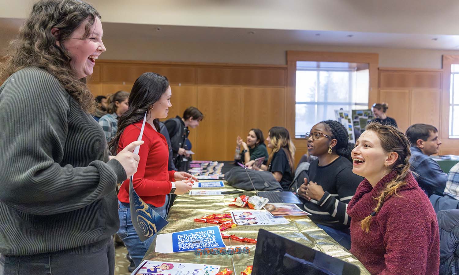 Students learn about the "Women in STEM" club at the Involvement Expo. 