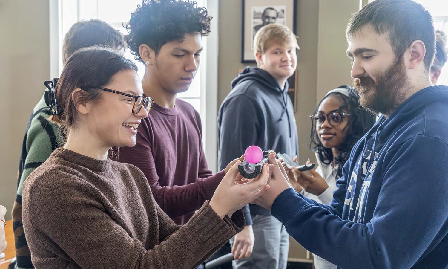 Students in “Inclusive Art and Humanities” with Director of the Teacher Education Program and Secondary Education Andie Huskie work on a teamwork and communication challenge. 