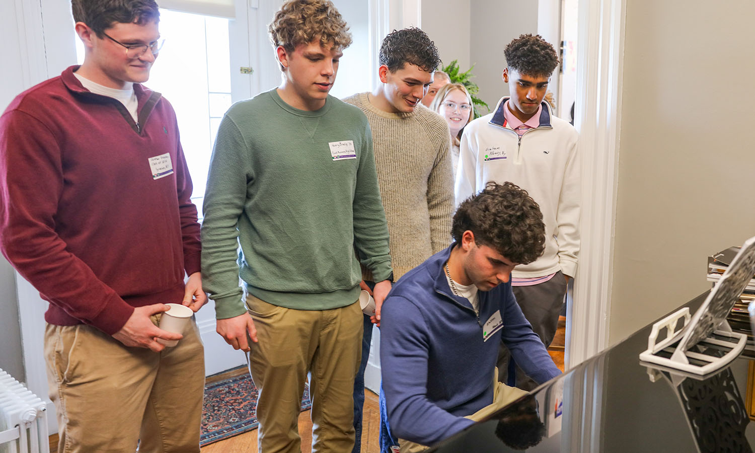 During Admitted Student Day weekend, students enjoy some music at the President's Open House. 