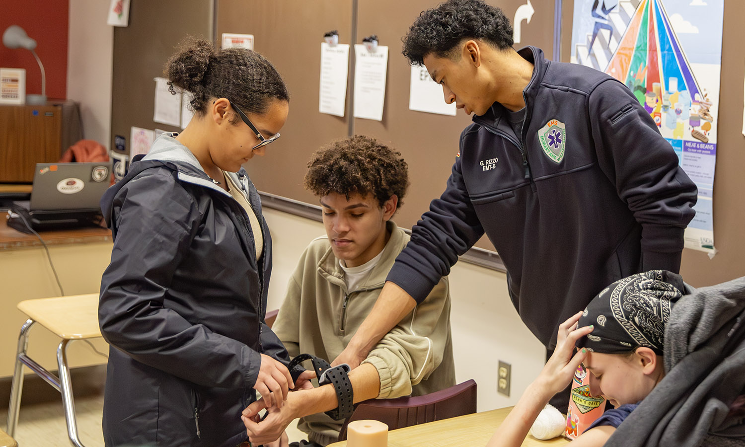 HWS EMS visited Geneva High School as part of the Stop the Bleed initiative. Here, Gavin Rizzo '27 instructs students how to apply a tourniquet. 