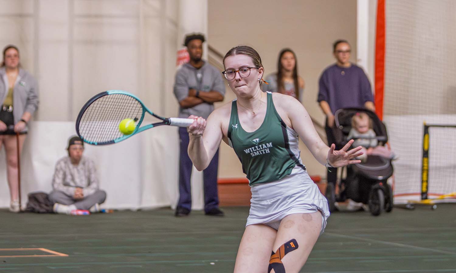 Elizabeth Legg ’26 hits a forehand as the William Smith tennis team earns a 7-0 win over SUNY Oneonta. 