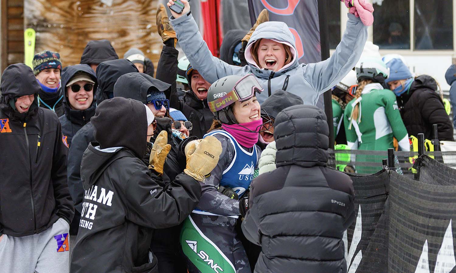 The Hobart and William Smith Alpine ski teams celebrate Aspen McAuley '29 as she finds out she won the 2026 USCSA Slalom National Championship. 