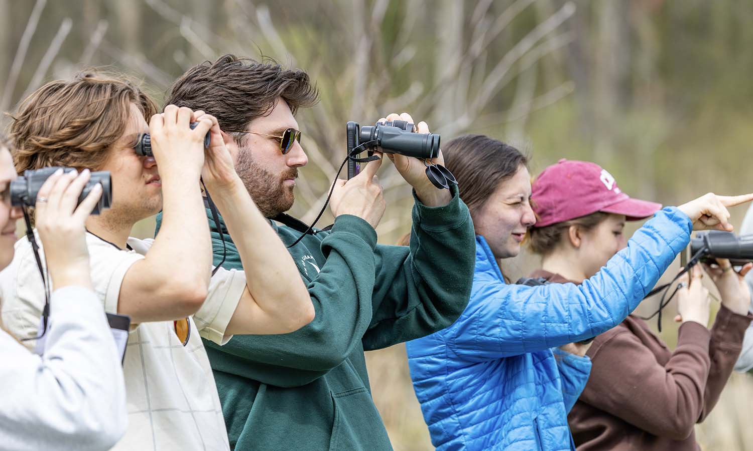 During a field excursion for “Wild Things: Nature and Memory” with Professor of Biology Meghan Brown and Professor of Spanish, Latin American, and Bilingual Studies May Farnsworth, students watch a Caspian Tern through binoculars while learning about the birds found at the Montezuma Audubon Center. 