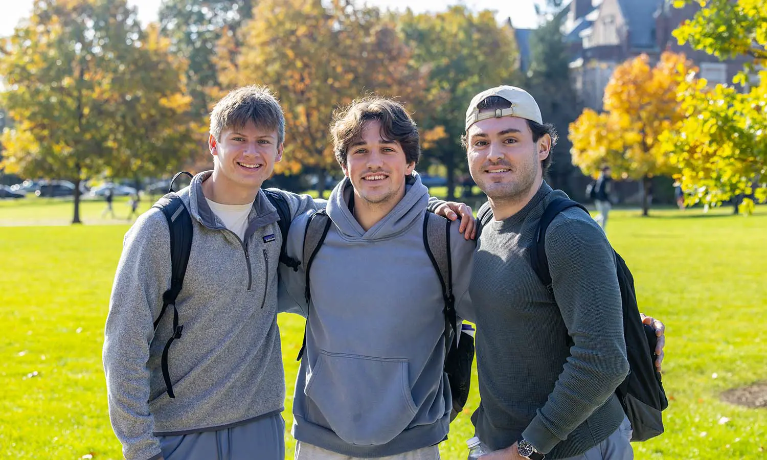 Andy Scoville '29, Tommy McDonough '29 and Brandon Sacchetti '27 stop for a picture while enjoying the fall weather. 