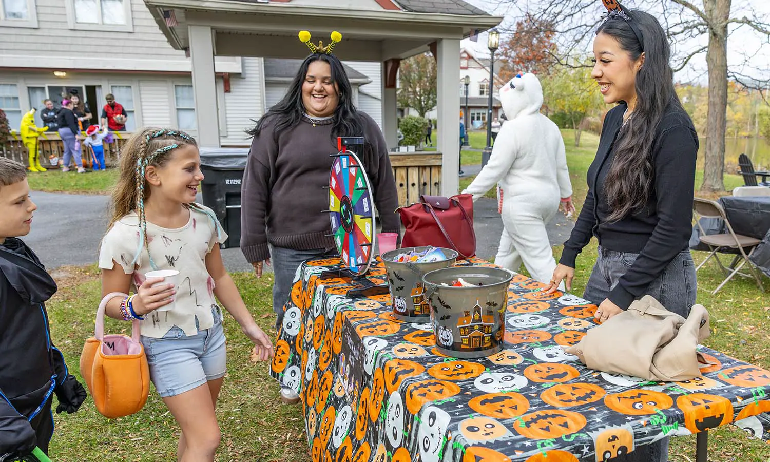 Members of the HWS community and their families go trick-or-treating at the Village at Odells Pond on Halloween. 