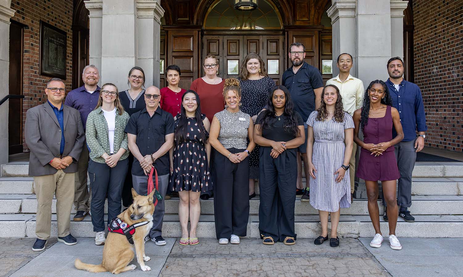 New faculty for the upcoming academic year pose for a photo on the steps of Coxe Hall. 