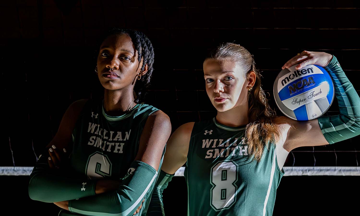 In Bristol Gym, Arielle Newsome ’28 and Emily Fulton ’28 show off the new William Smith volleyball uniforms. 