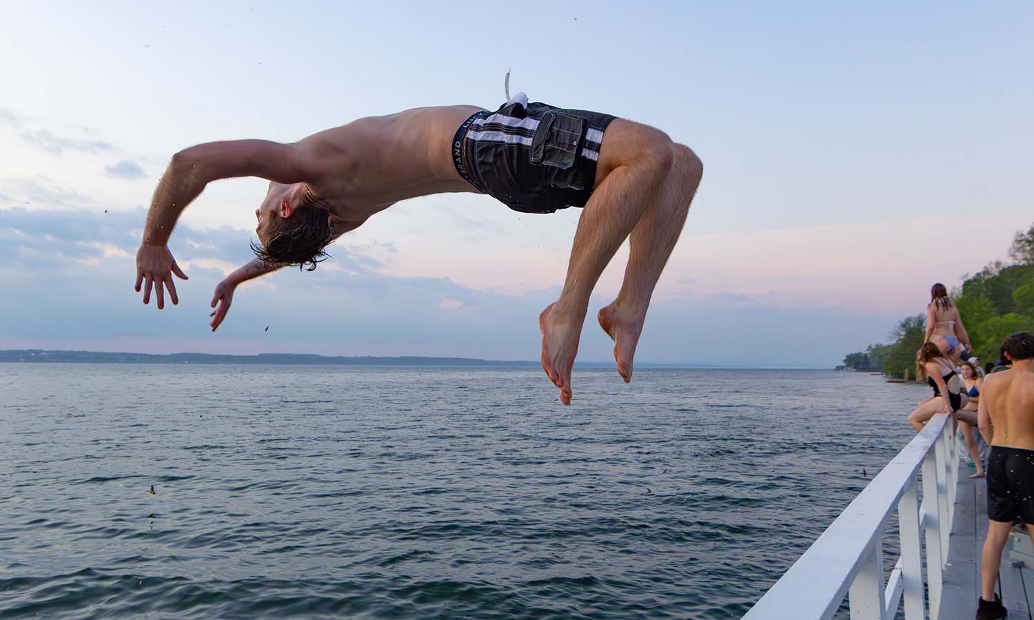 Niko Lutz ‘26 performs a backflip into Seneca Lake. 