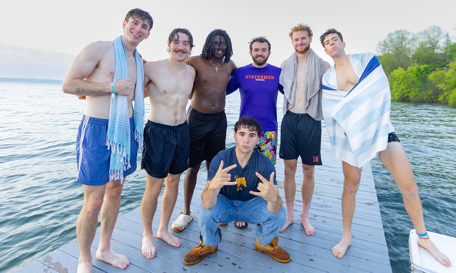 Seniors on the Hobart rowing team pose for a photo before heading across the lake to the Miltenberger and Bennett-Hooper Rowing Center. 