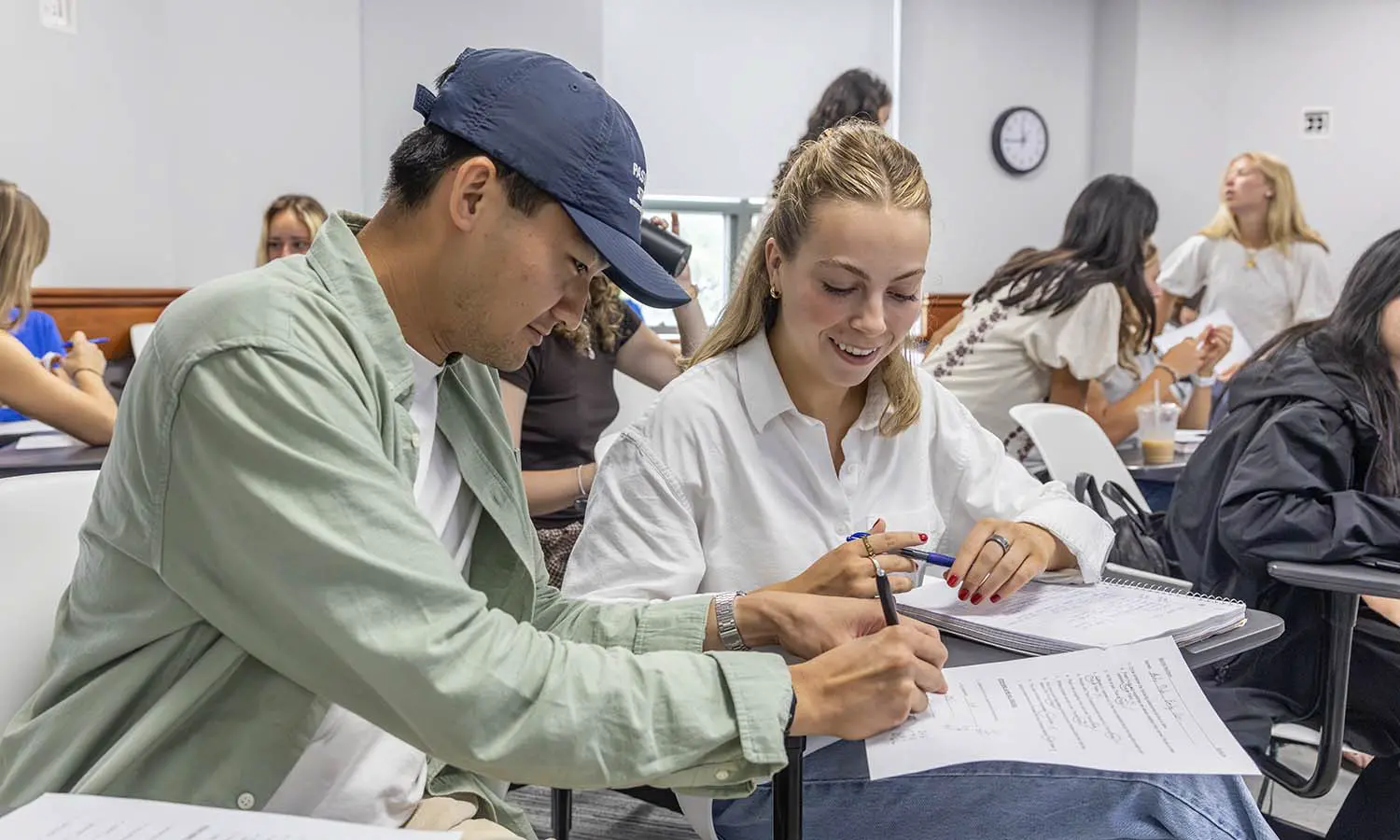 Andy Dinh ’27 and Emily Cain ’27 work on an in-class assignment during “Nutrition” with Professor of Biology Patricia Mowery. 