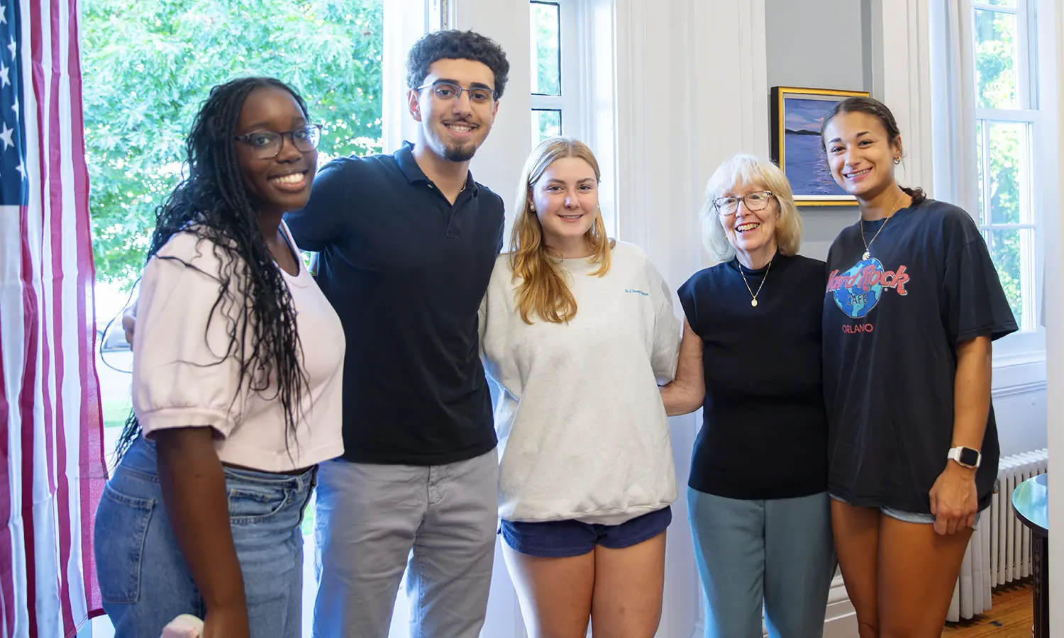 Mary Herlihy Gearan poses with students during the weekly Open House she and President Mark D. Gearan host at their home.  