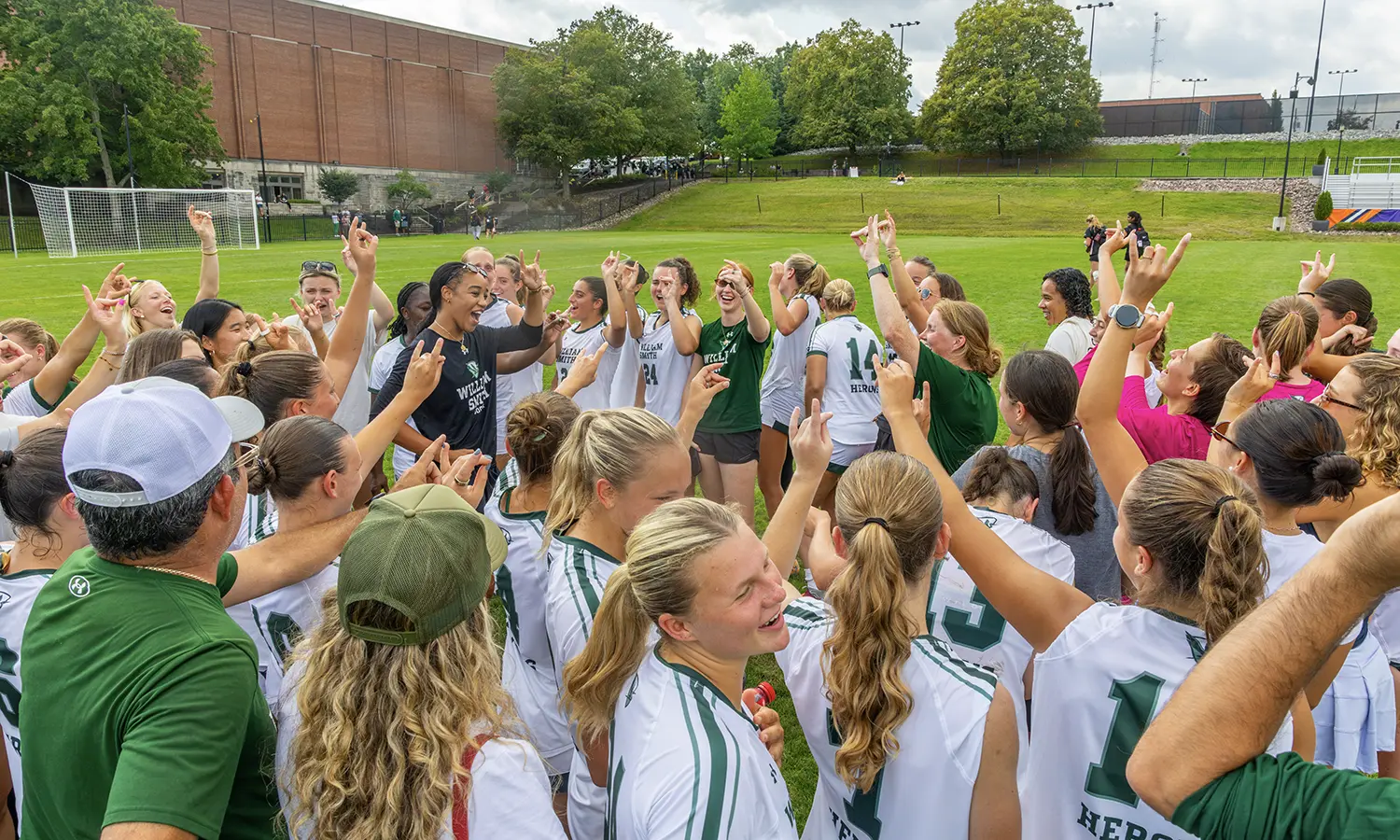 The William Smith soccer team along with alumnae break a postgame huddle, following the Herons 2-1 upset over No. 21 Carnegie Mellon on Sunday. The Herons are ranked 16th in the nation in the first United Soccer Coach’s Poll of the season. 