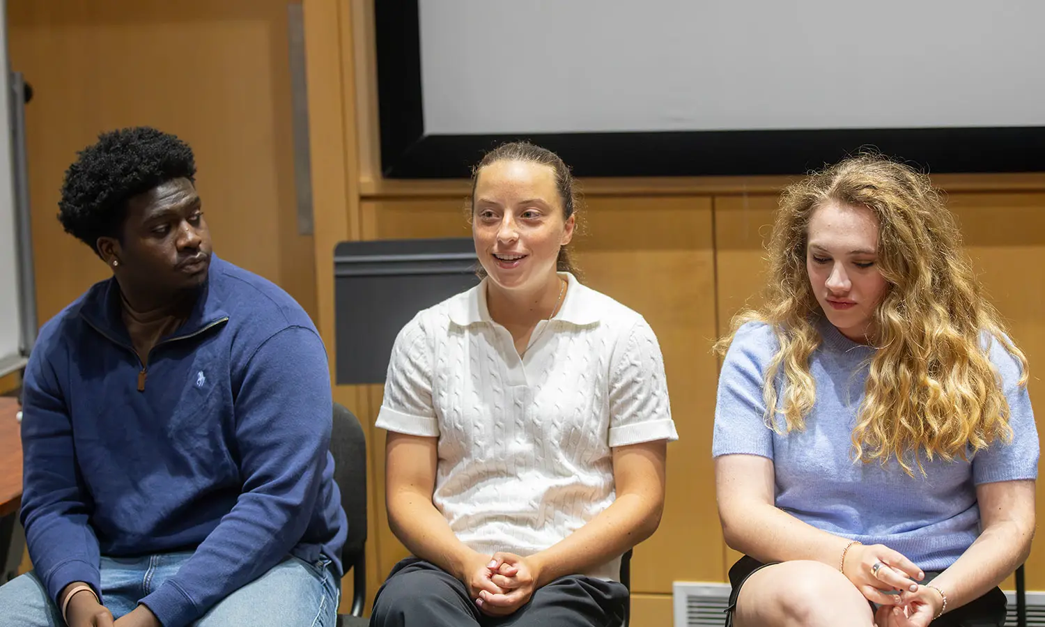 Duke Charles '27, Miranda DeMura '27 and Cristen Bonville ’27 discuss their summer internships during a retrospective organized by Career Services. 