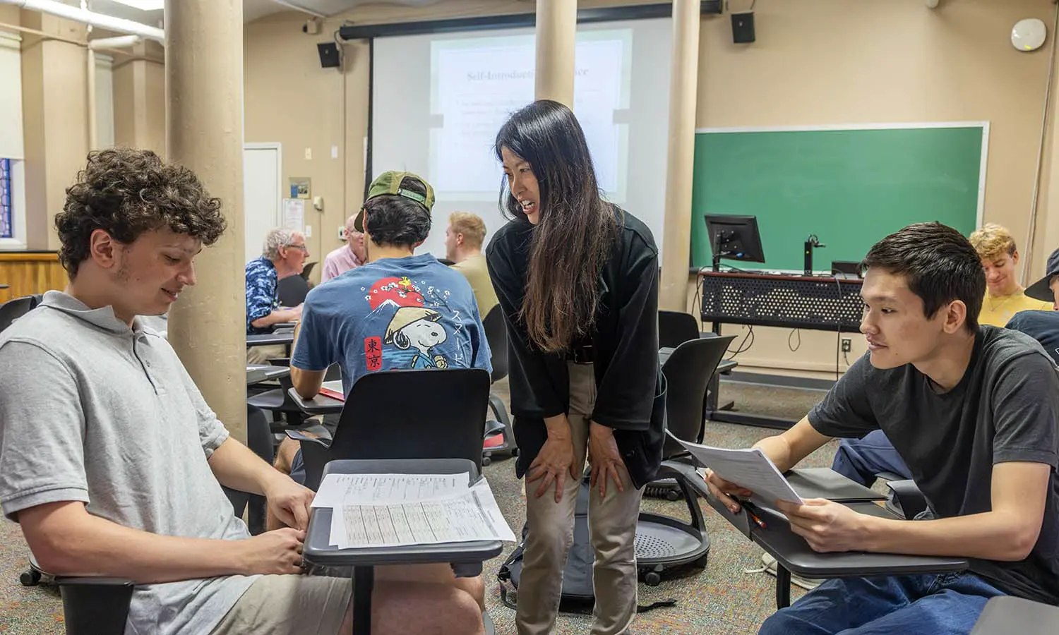 Teaching Instructor of Asian Studies Yi-Tung Wu listens to students as they practice speaking in “Beginning Chinese I.” 