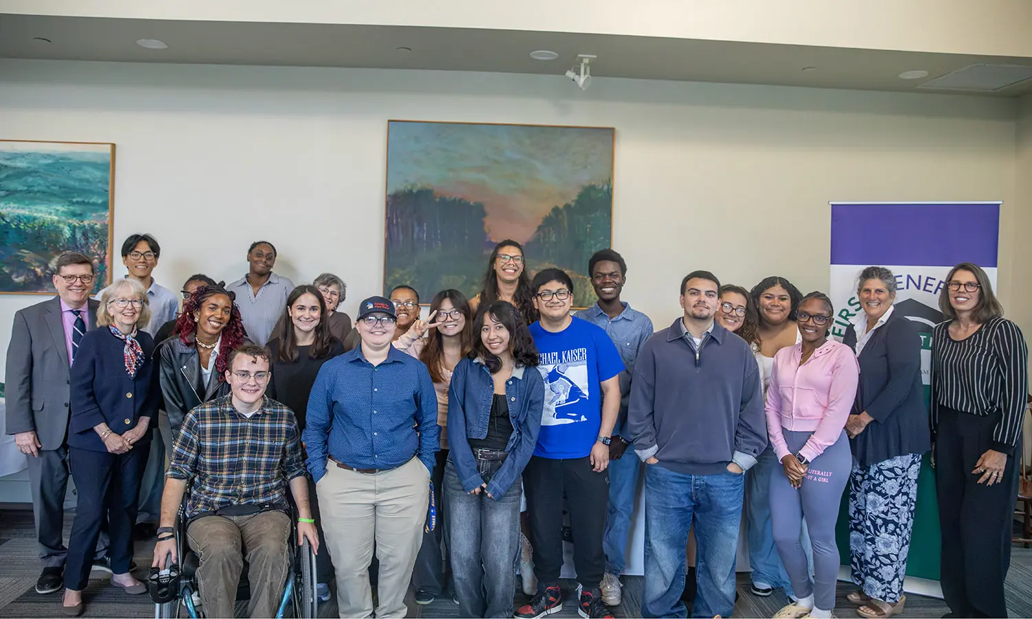 President Mark D. Gearan and Mary Herlihy Gearan join students, faculty and staff for a group photo during the First-Generation Initiative Welcome Dinner in the Common Room. 