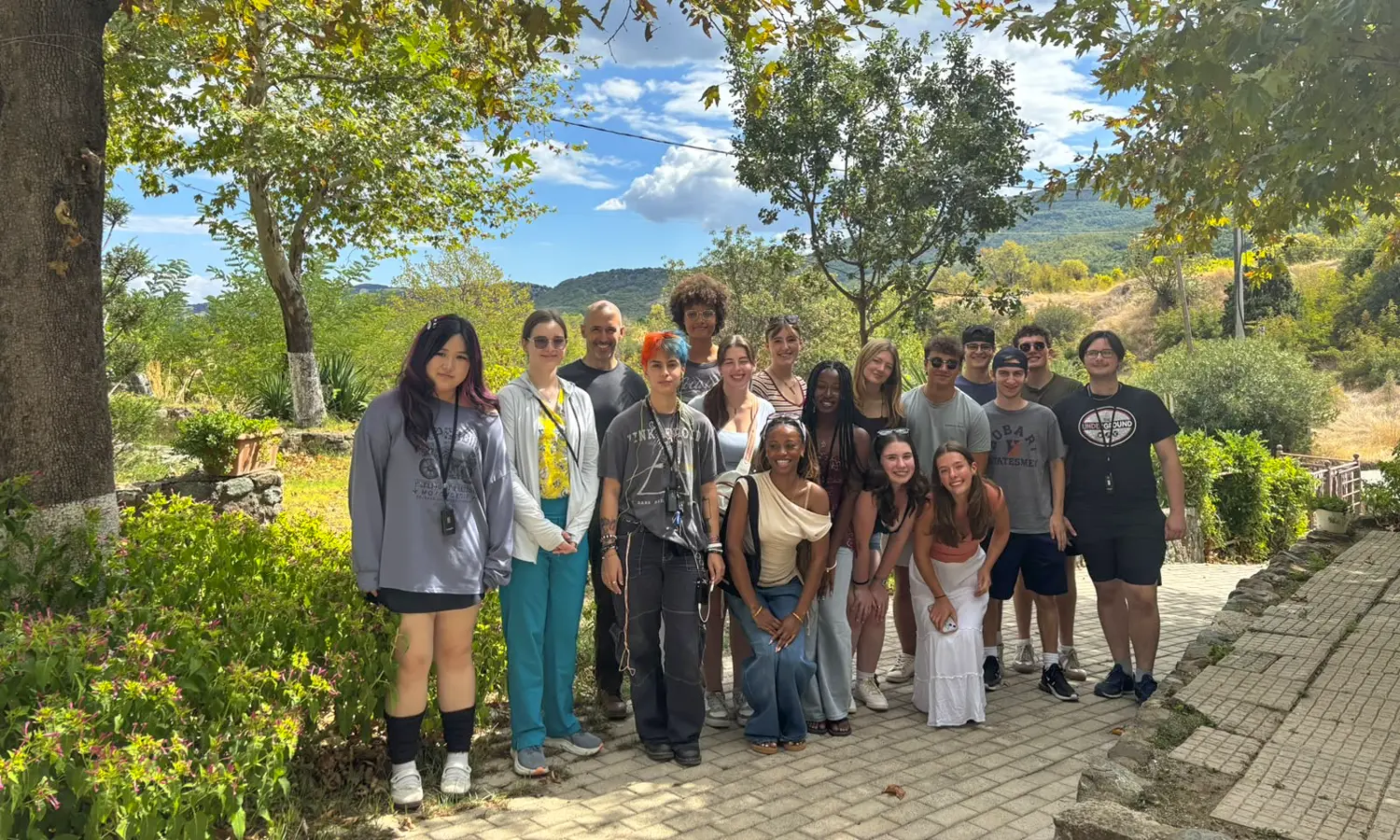 Students participating in the Sophomore Global Studies Program gather for a photo on the Anatolia American University campus in Thessaloniki, Greece with Professor of Theatre Chris Hatch.  