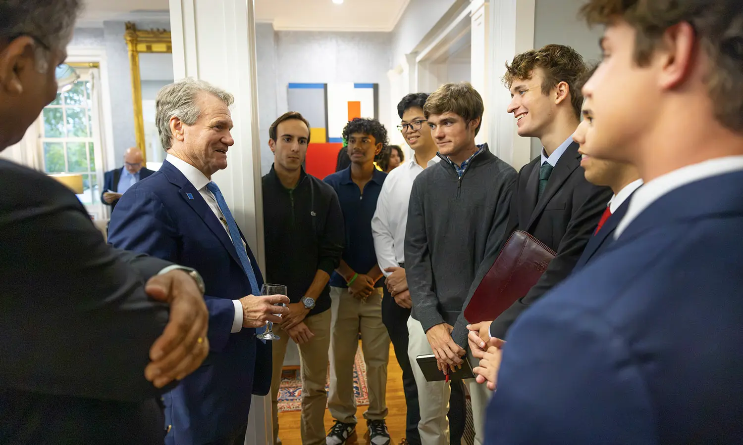 Bank of America Chair and CEO Brian Moynihan visits with students at the President's residence before speaking at the 2026 Anderton Economic Policy Symposium. 