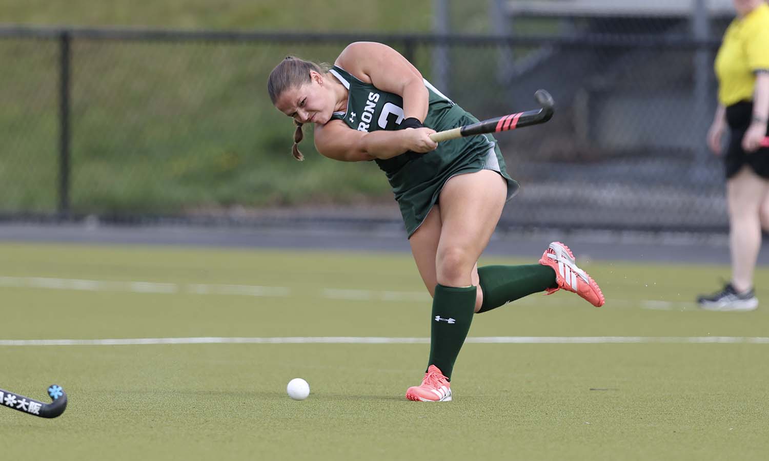 Caroline Kogut '28 sends a long pass down field as the William Smith field hockey team took on Ursinus on McCooey Field for its home opener. 