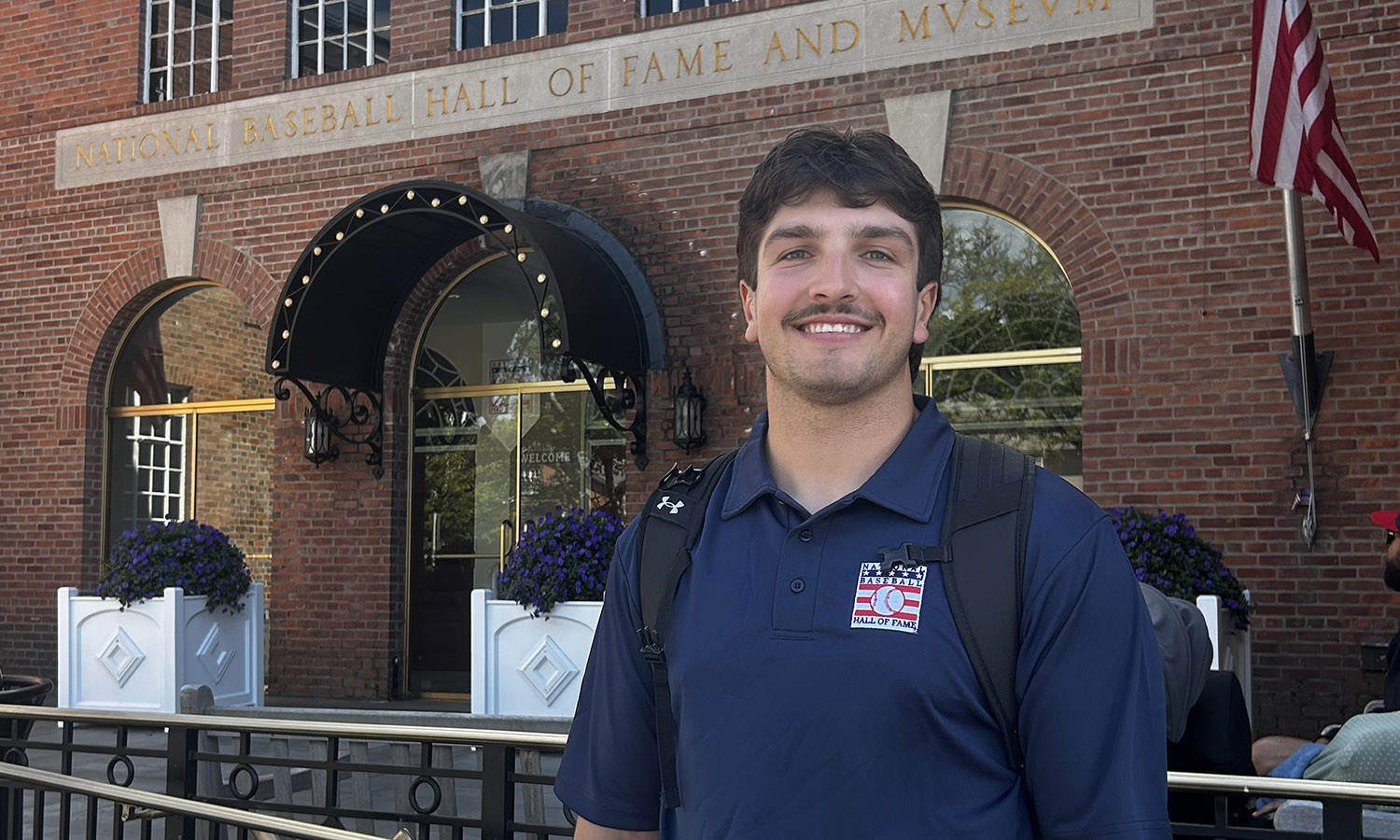 Hobart baseball player Sam Oestreicher '27 outside of the National Baseball Hall of Fame, where he spent the summer as a public programming intern, leading museum tours, hosting trivia and welcoming guests from around the world. 