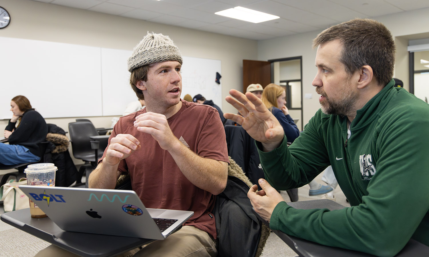 A member of the HWS sailing team, Cooper Delbridge ’26 discusses a statistical model for his team’s interactive dashboard project with Professor of Mathematics & Computer Science Jonathan Forde during their Data Analytics Capstone. 