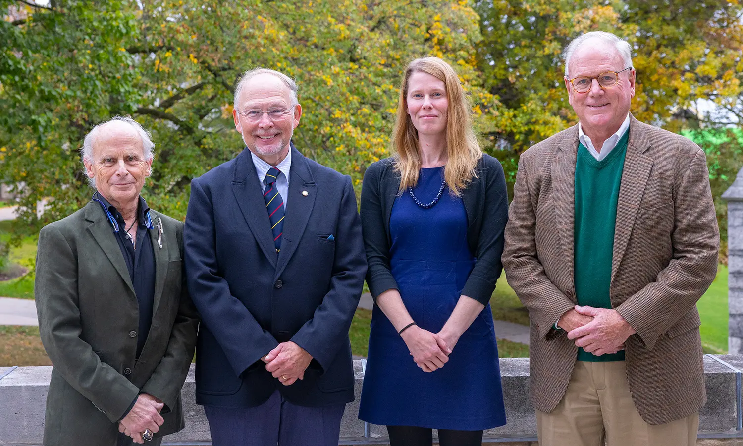 Dr. Bruce Bauer '70, Dr. Arnold Cohen ’71, P’05, Associate Professor of Gender, Sexuality, and Intersectional Justice Jessica Hayes-Conroy and Dr. Timothy Crowley pose for a photo before Crowley's presentation "The Meteoric Rise in the Cost of US Healthcare."  