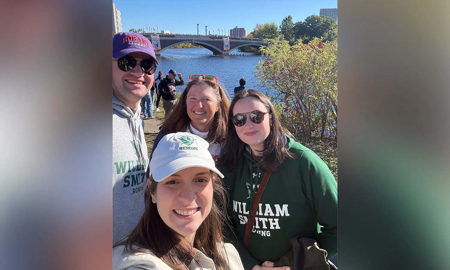 Sarah ’21, MAT ‘’ 22 and Christopher Guertler ’21 and Freya Birkas-Dent ’22 cheer on the Herons at the Head of the Charles.  