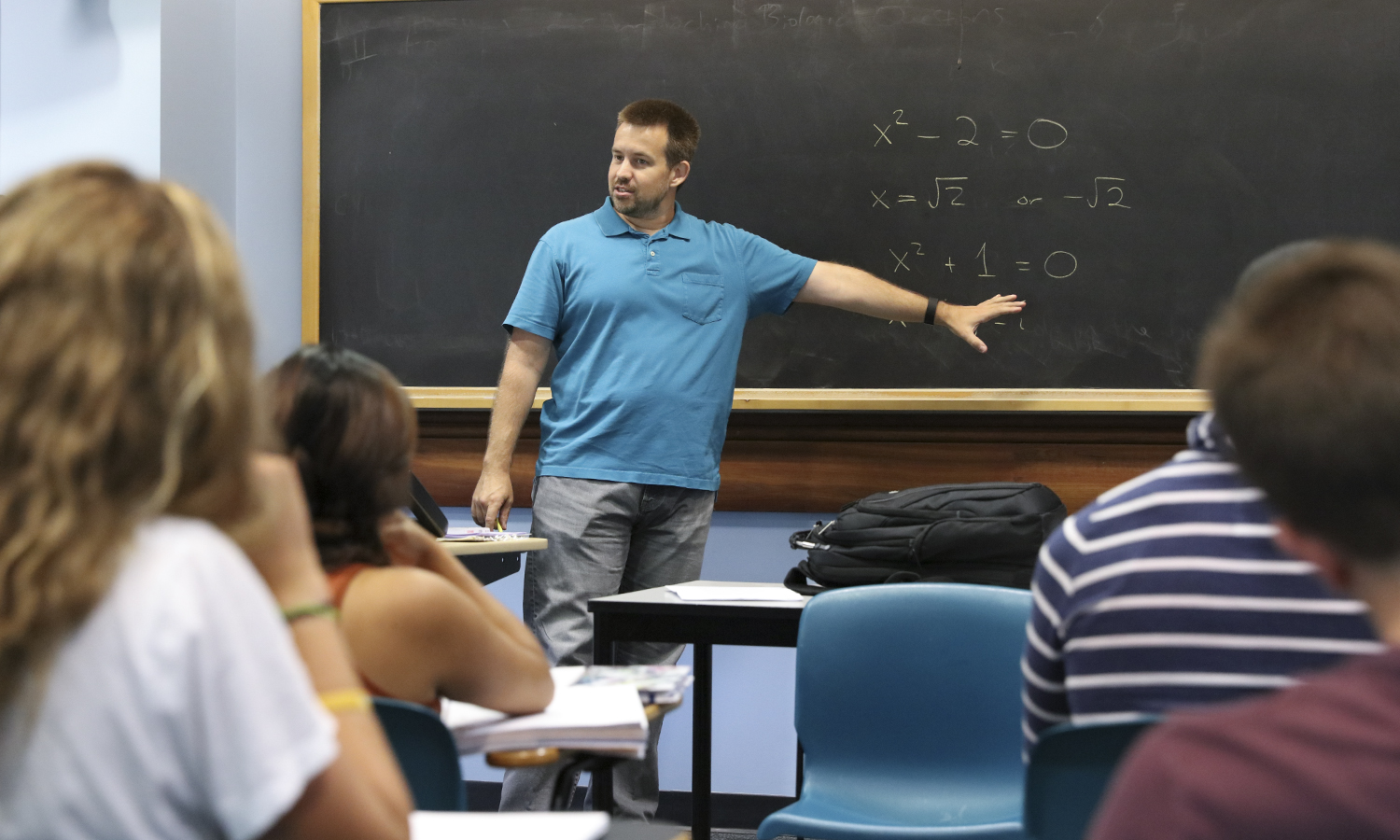 Prof. Jon Forde teaches at a blackboard