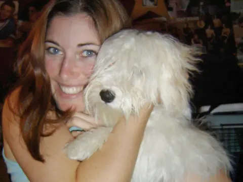 Brittany Holler Barkley as a student, with her Havanese puppy Melly