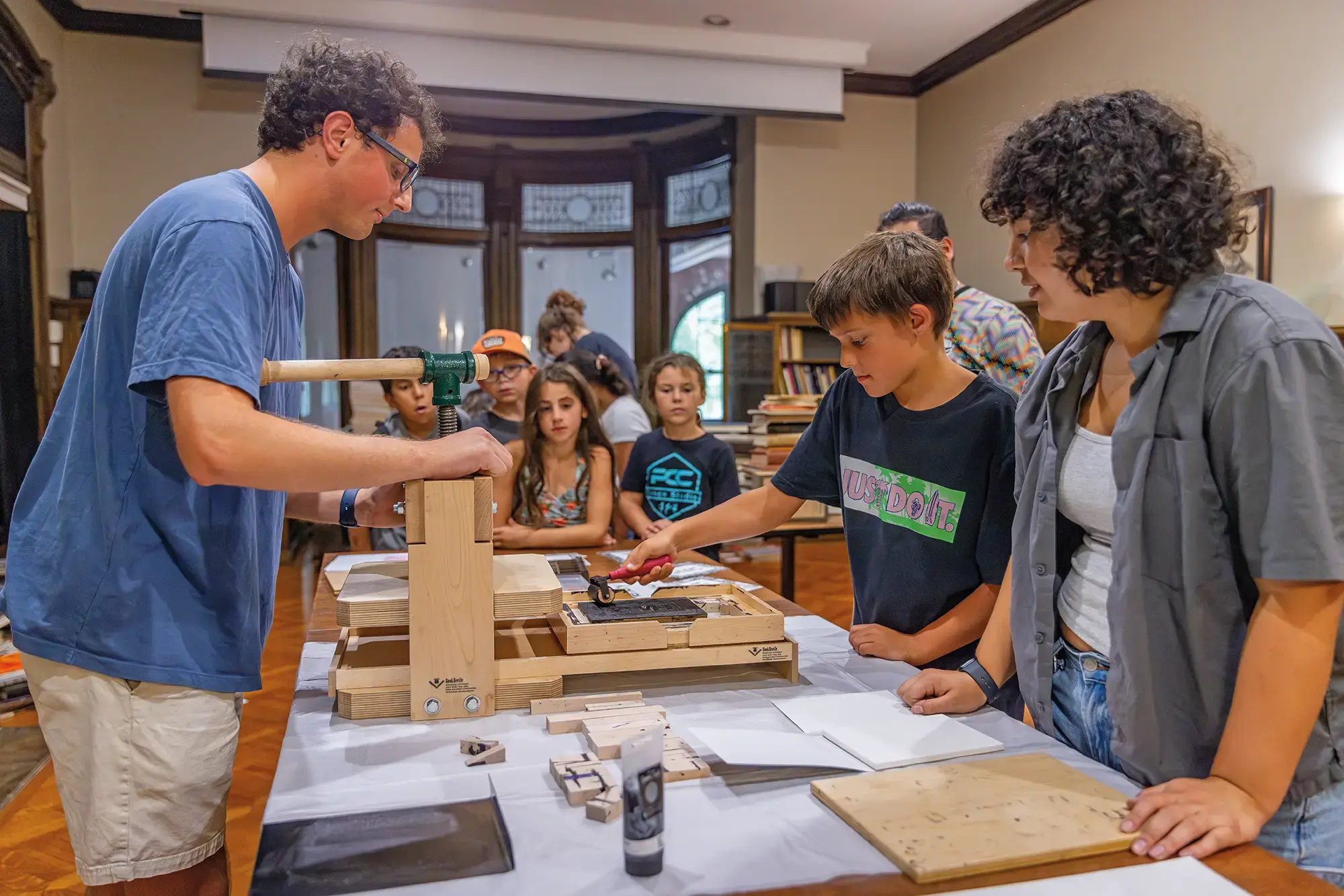Connor Gasper '26 and Alyssa Hanuscin '27 lead a Matters of Memory program for local children to learn about the printing press