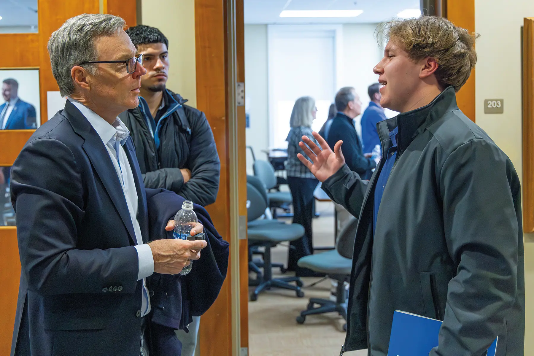 Board Chair Joseph C. Stein III '86 talks with a student about his career trajectory