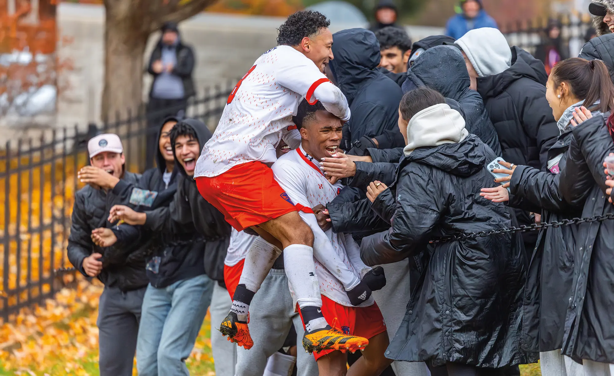 Matheus Souza '26 and La Zai Outerbridge '27 celebrate the game-winning goal during the Liberty League Men's Soccer Championship