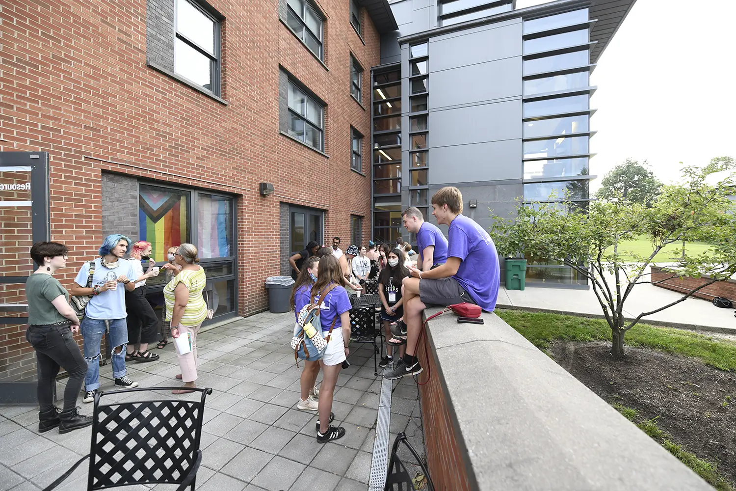 Students gather on the patio outside the LGBTQ+ Resource Center