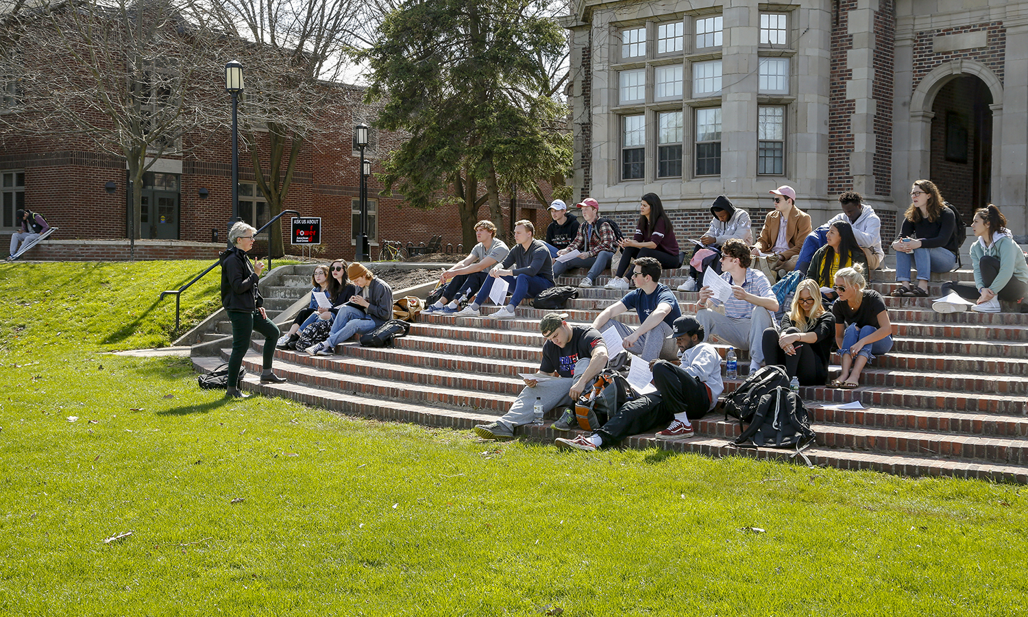 a class on the steps of Coxe Hall