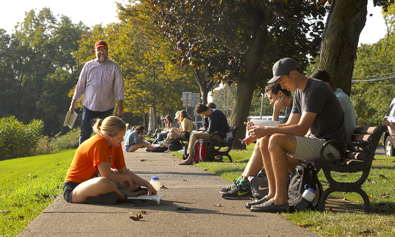 Professor Matt Crow teaches a class on the benches along South Main Street