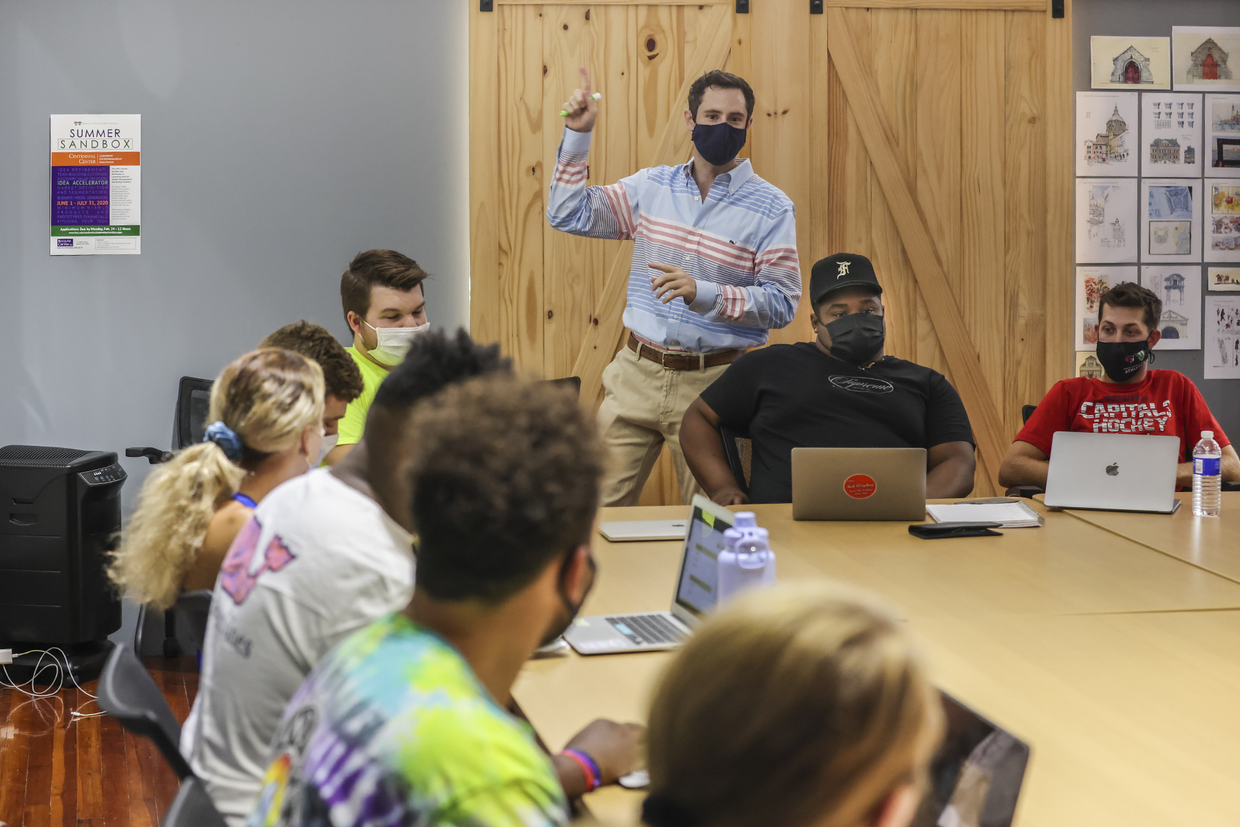 Professor Robinson Murphy teaches a management course